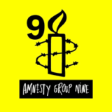 9 Amnesty Group Nine (black outline of a candle surrounded by barbed wire, with number 9 beside the flame, all on yellow backgroud, and white-on-black text underneath)
